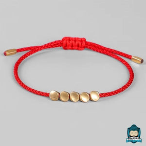 Bracelet-Tressé-Tibétain-Rouge-et-Perles-de-Cuivre-Rouge-La-Maison-de-Bouddha