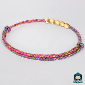 Bracelet-Tresse-Tibetain-Rouge-et-Perles-de-Cuivre-Arc-en-Ciel-noeud-coulissant-La-Maison-de-Bouddha