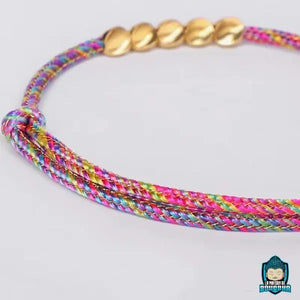 Bracelet-Tressé-Tibétain-Rouge-et-Perles-de-Cuivre-ajustable-Arc-en-Ciel-La-Maison-de-Bouddha