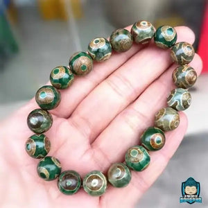 Bracelet-tibetain-en-perles-Dzi-Talisman-de-protection-et-prosperite-bouddhiste-perles-naturelles-agate-fabrication-artisanale-La-Maison-de-Bouddha