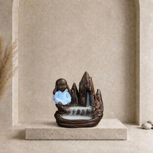 Porte-encens Moine de la Sagesse en céramique avec robe bleue et cascade de fumée