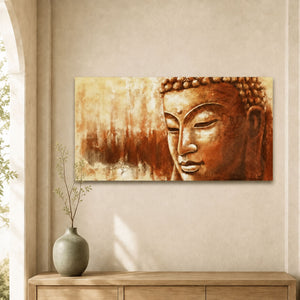 Toile peinture Bouddha au visage ocre et cuivré exposée au-dessus d’un meuble en bois