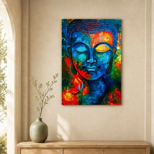 Tableau Bouddha multicolore au-dessus d’un buffet en bois clair, près d’un vase et de branches végétales