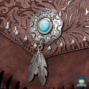 Sac-a-dos-cuir-vintage-ethnique-piece-ornement-decoratif-couleur-argent-pierre-turquoise-et-pendentif-2-plumes-La-Maison-de-Bouddha
