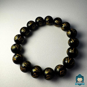 Bracelet-Onyx-Mantra-Tibétain-perles-noires-gravées-de-mantras-couleur-or-perles-polies-12-mm-La-Maison-de-Bouddha