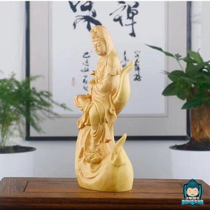 Statue-bois-Guanyin-Protectrice-des-etres-en-souffrance-photo-de-profil-gauche-La-Maison-de-Bouddha