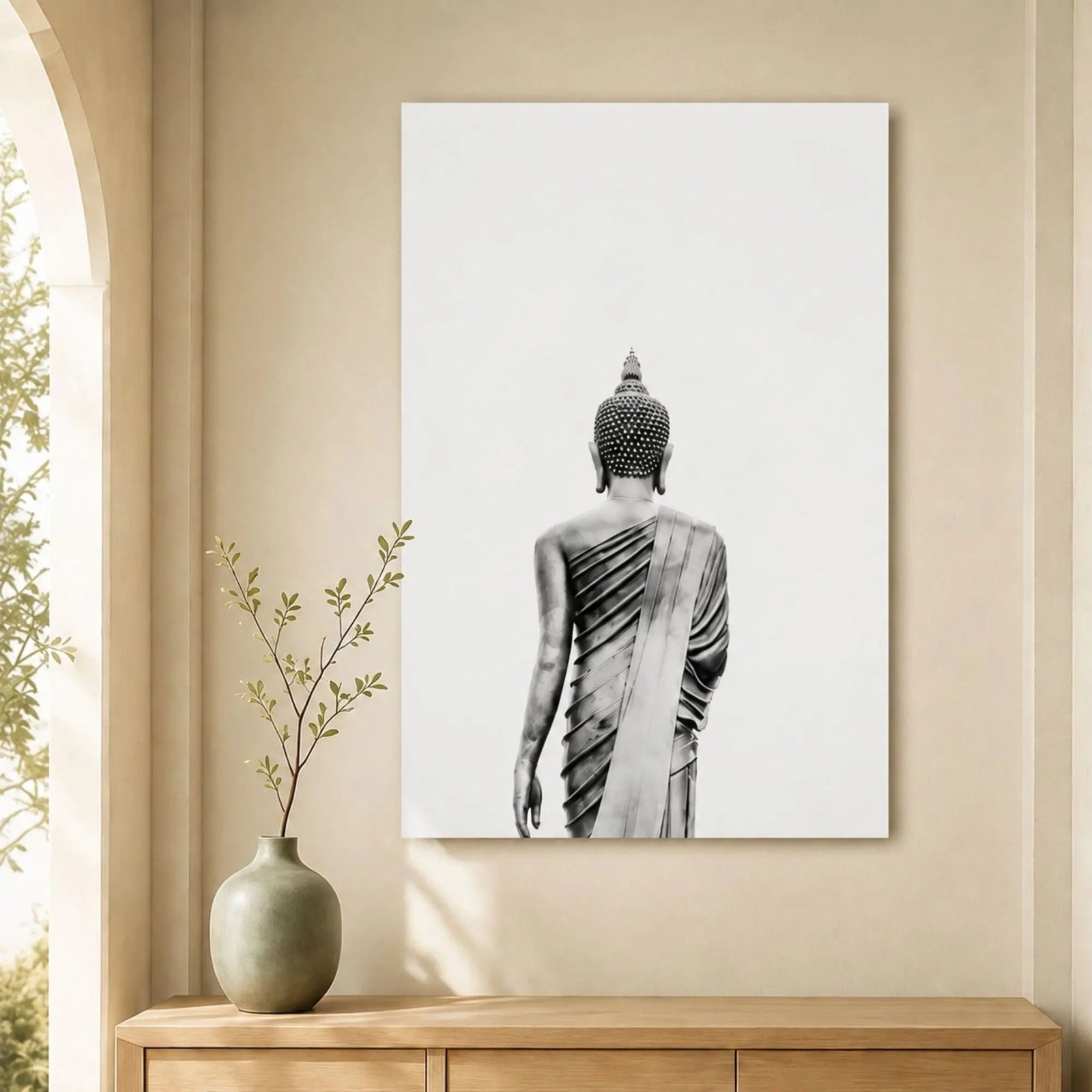 Tableau Bouddha noir et blanc 1 pièce installé au-dessus d’un meuble en bois clair dans une décoration zen