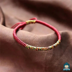 Bracelet Tibetain couleur bordeaux en Coton tressé à la main par des moines bouddhiste