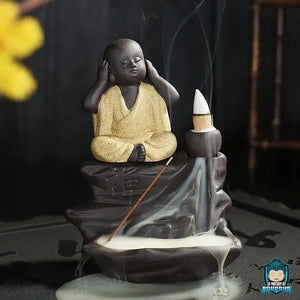 Brule-Encens-Bouddha-Noir-en-ceramique-moine-robe-jaune-taille-environ-hauteur-9-cm-longueur-12-cm-largeur-9-cm-poids-470-grammes