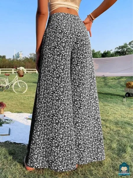 Pantalon-ample-fluide-taille-haute-imprime-floral-Noir-en-polyester-et-elasthanne-coupe-large-vue-de-dos