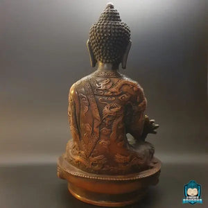 statue-bouddha-medecine-assis-sur-une-fleur-de-lotus-drape-kesa-dragon-gravee-La-Maison-de-bouddha